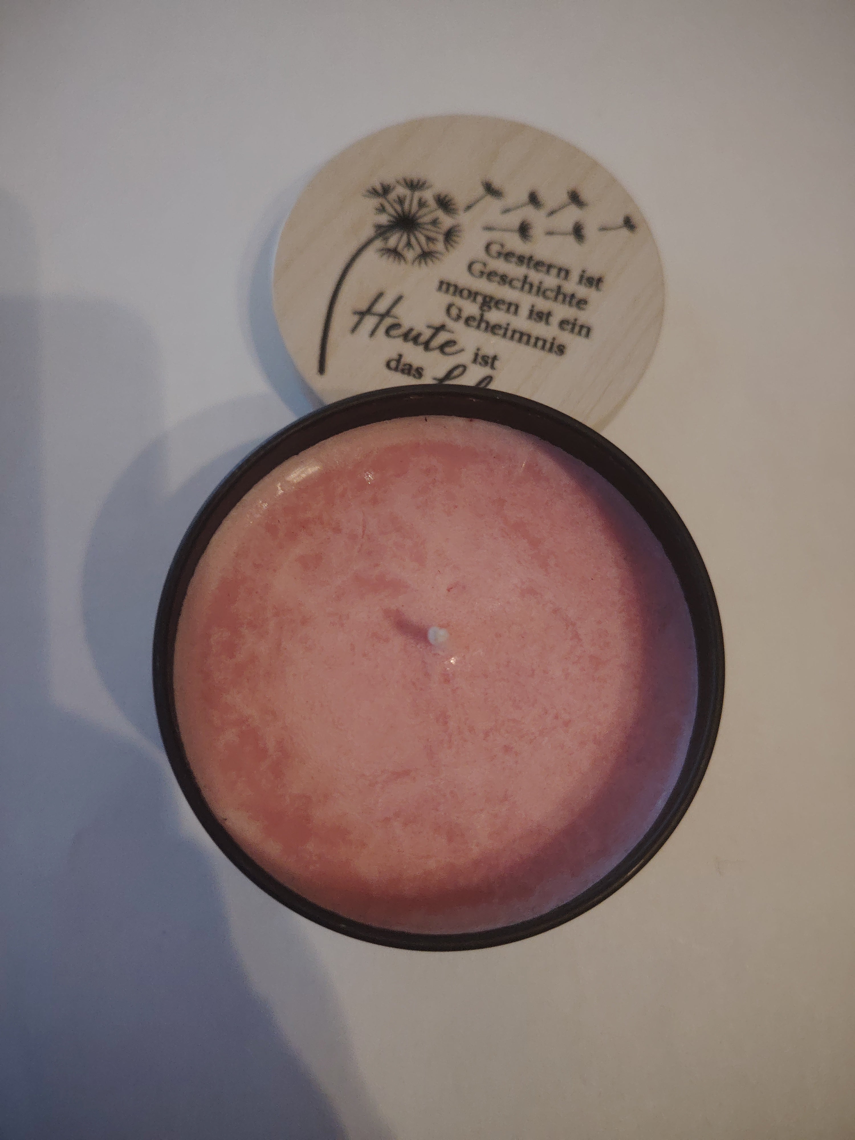 Scented candle with rose fragrance