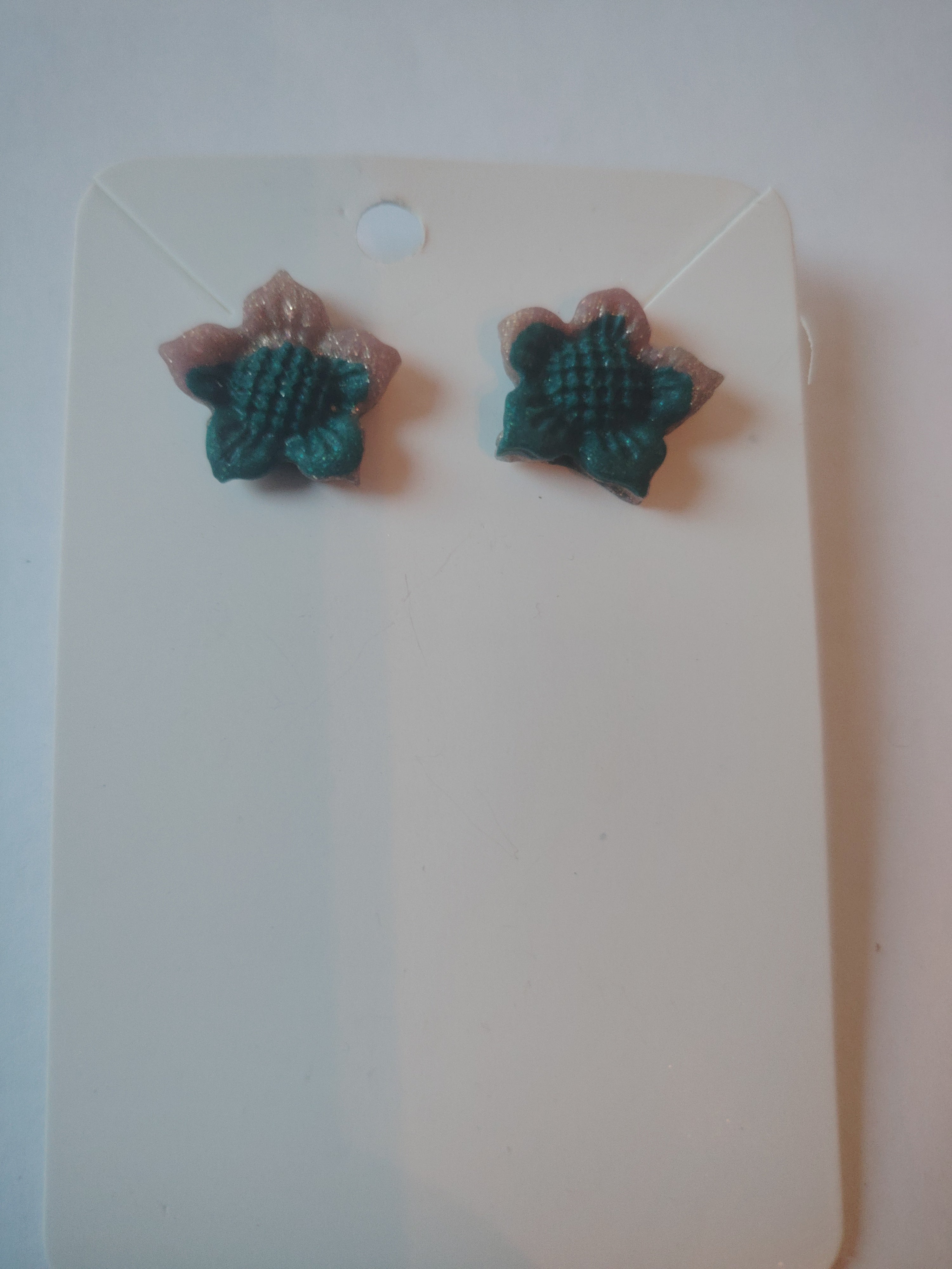 Floral style earrings in green and pink glitter