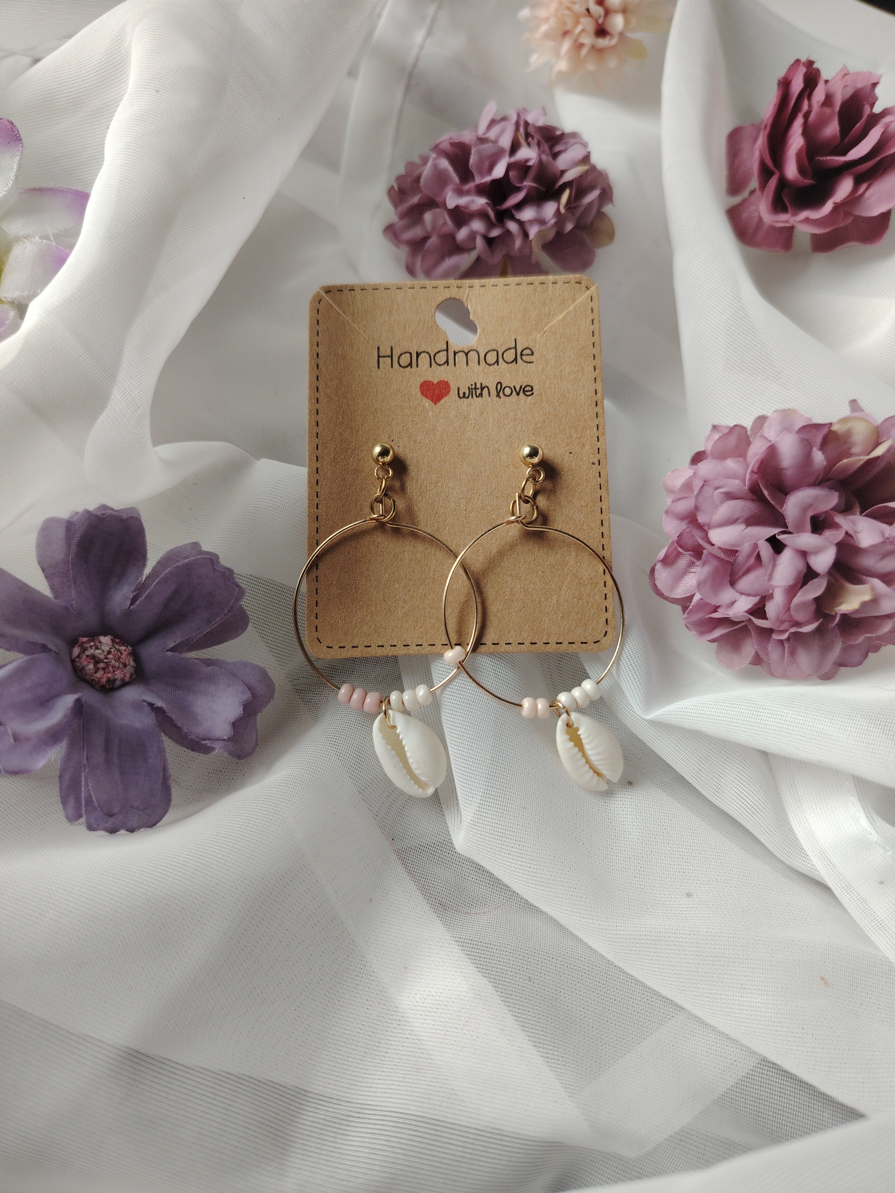 Hoop earrings with small pearls and cream-white shells
