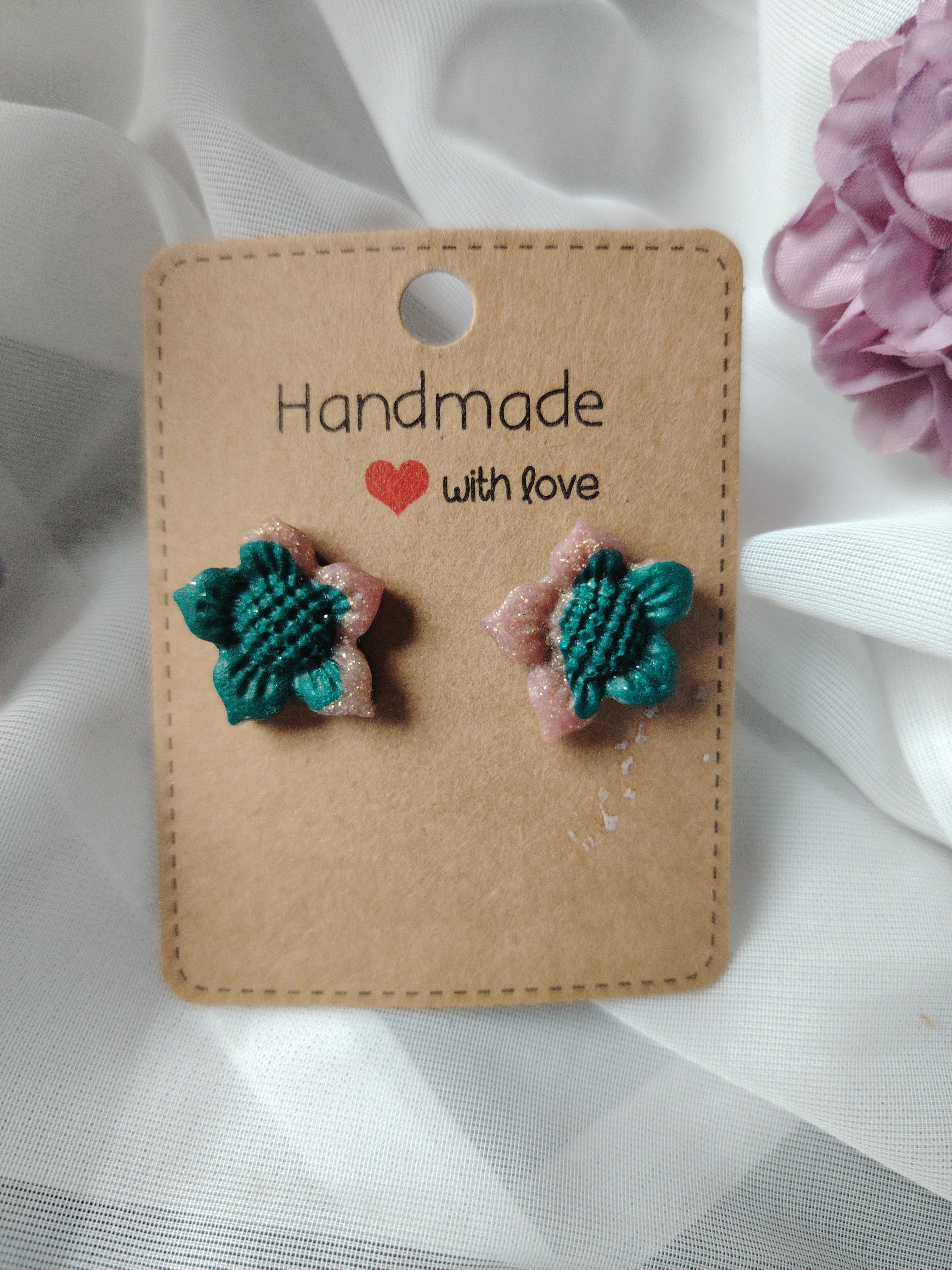 Floral style earrings in green and pink glitter
