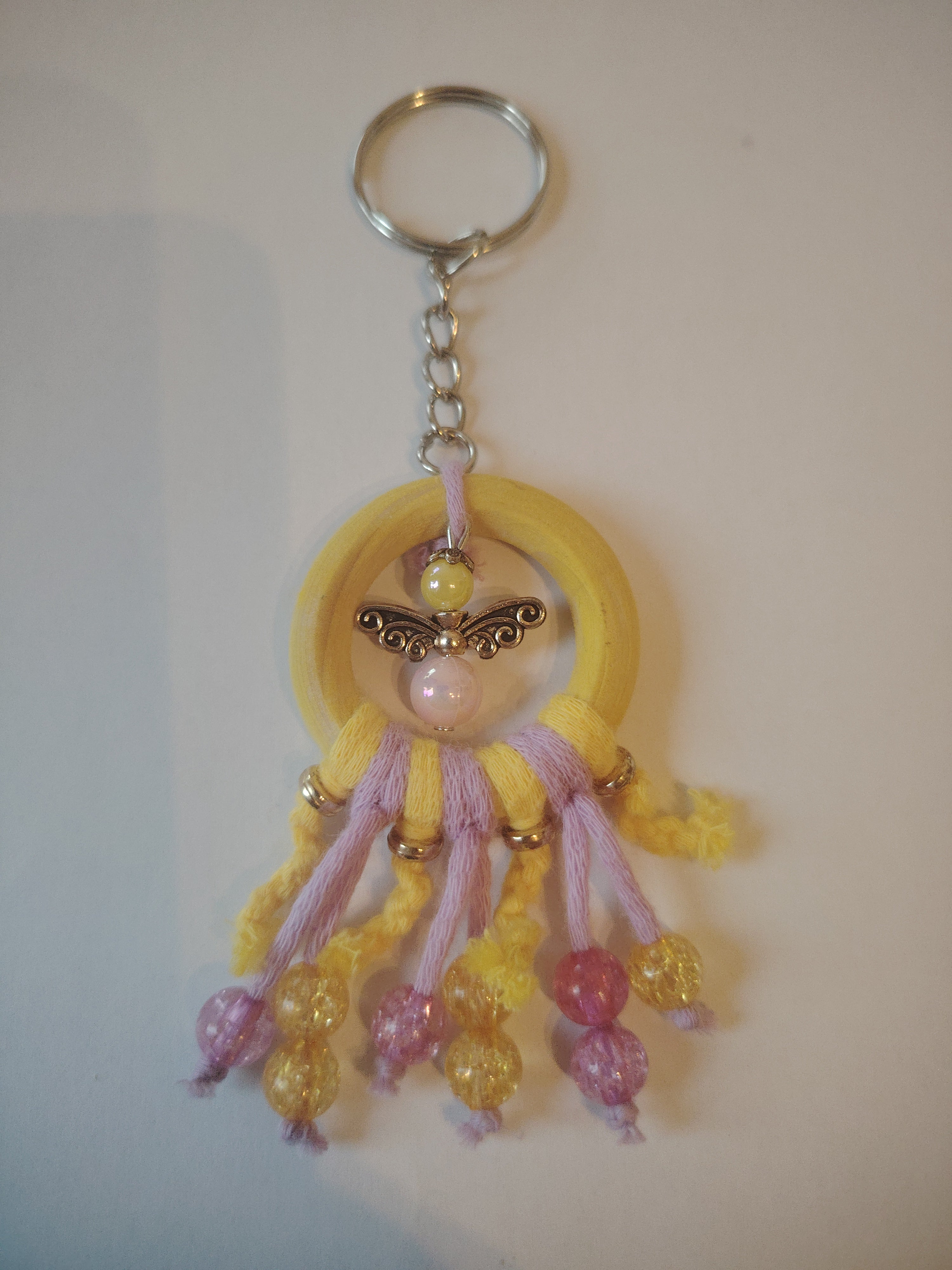 Keyring in yellow with cute guardian angels and pretty colorful glass beads
