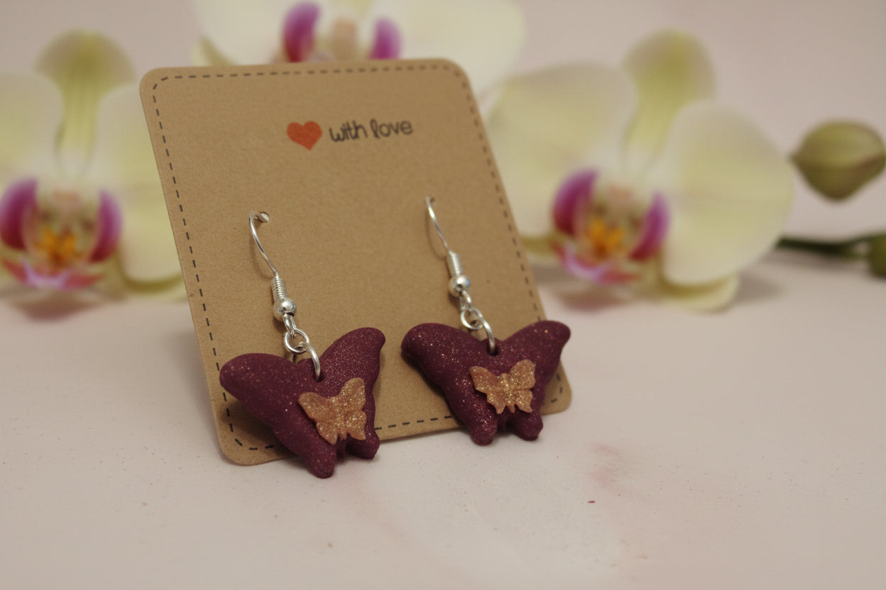 Earrings with cute butterflies in purple glitter, decorated with small pink butterflies