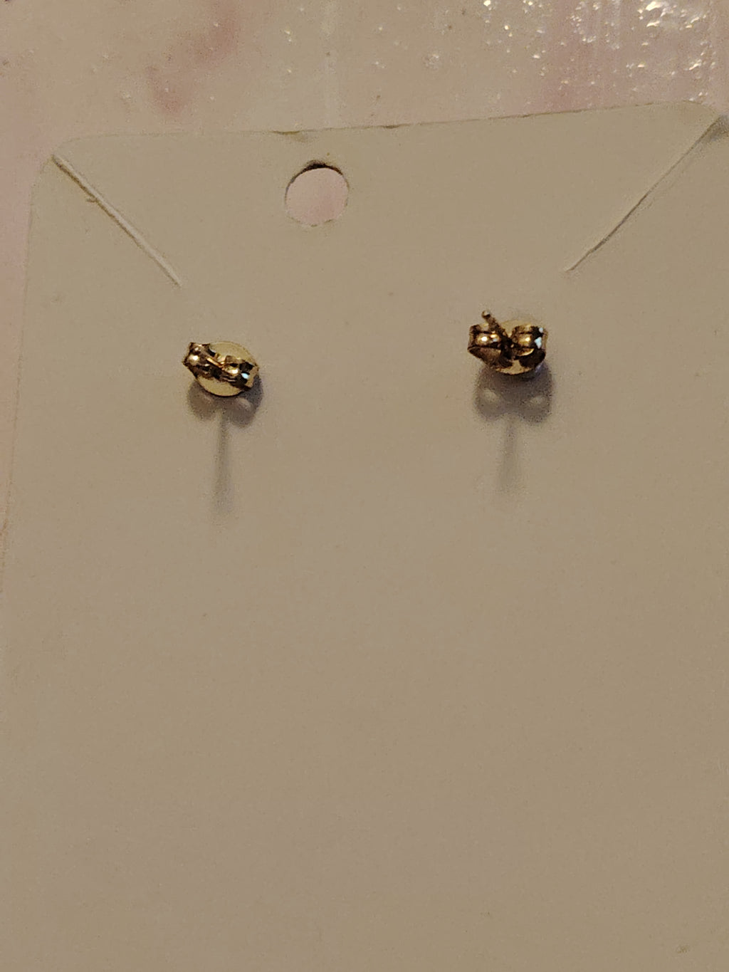 Oorbellen met glinsterend goud in rooslook