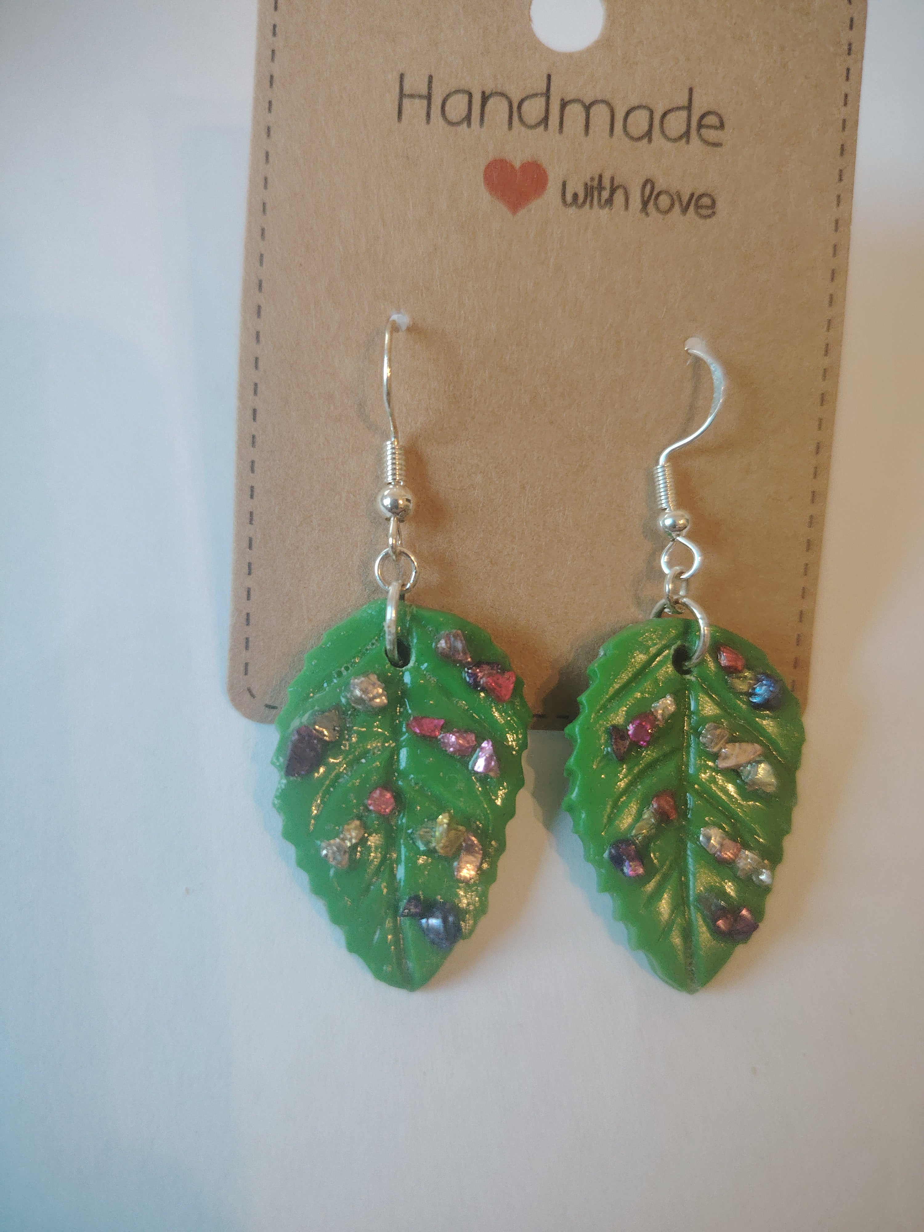 Green leaf pendant interspersed with colorful stones